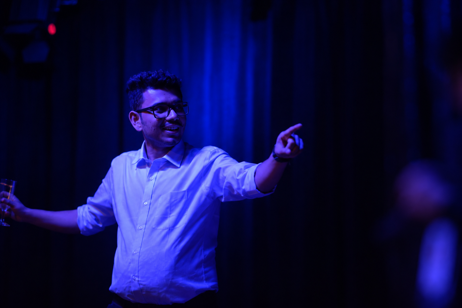 Performing under blue stage lighting